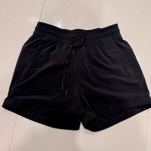 Lululemon women’s black leisure shorts, not lined; size 4